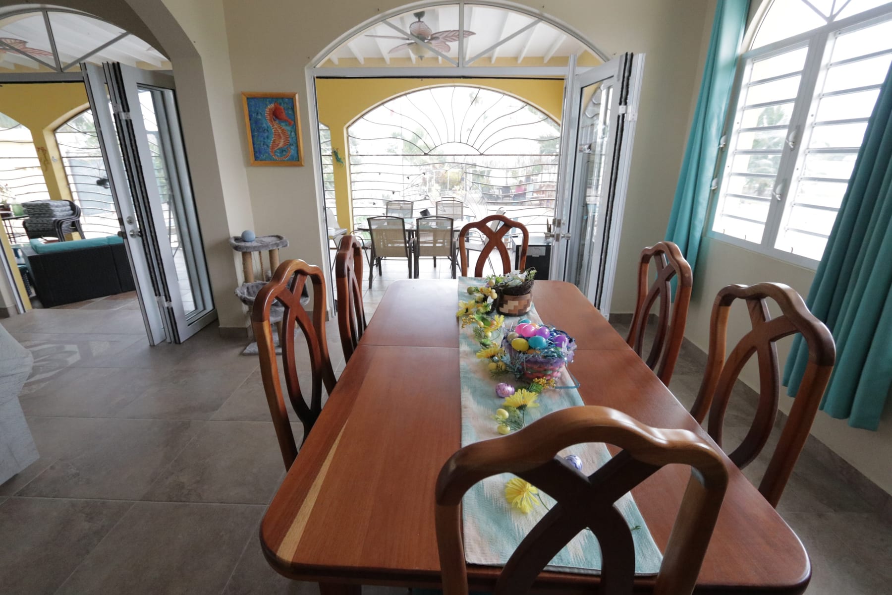 Dining area with arched bay-view windows at 47 Consejo Beach Trail