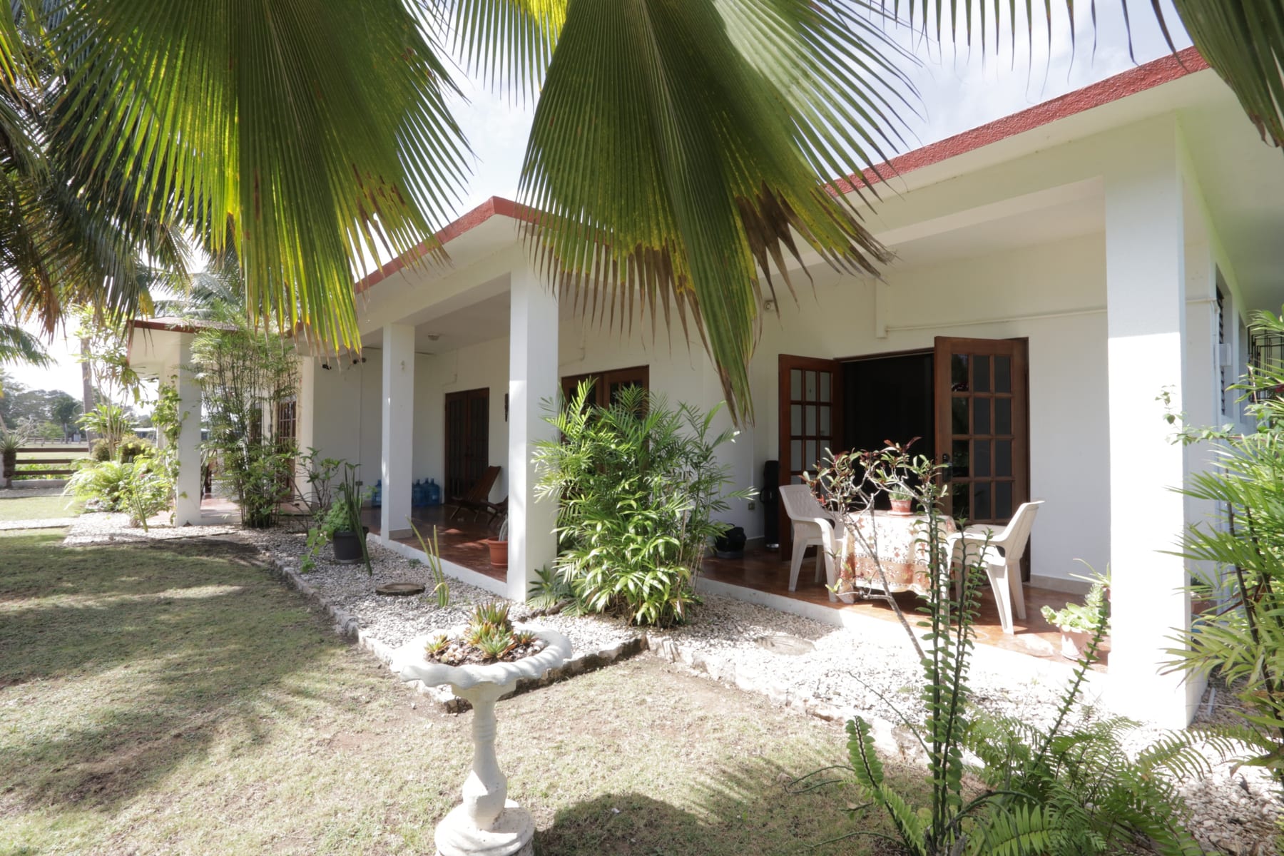 Landscaped grounds and guest quarters at Royale Manor